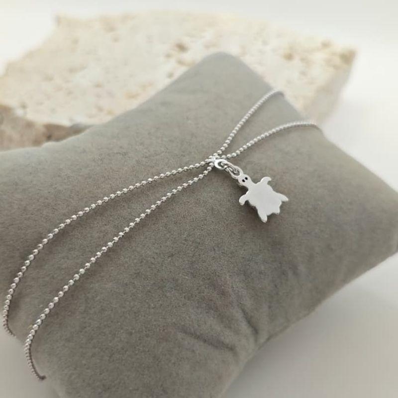 tornozeleira dupla com tartaruga rhodio